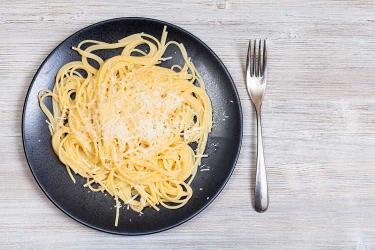 Plain buttered noodles with oil and cheese make a simple Girl Dinner.