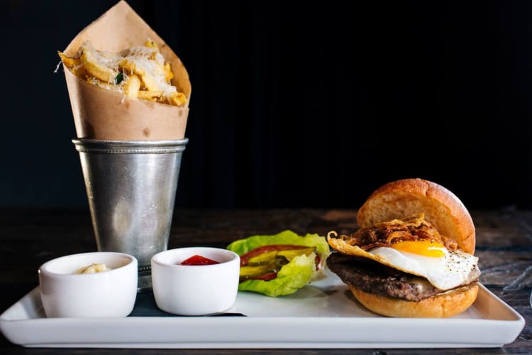 a burger with fries, artfully photographed