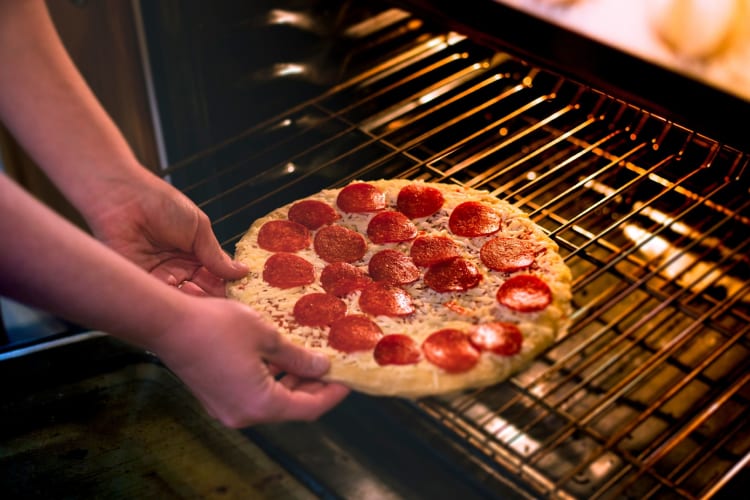 Frozen pizza is a nearly zero-effort Girl Dinner idea.