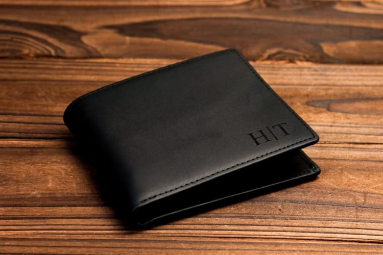 a leather wallet with initials