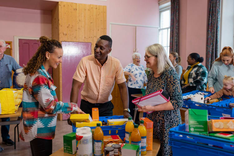 Food bank volunteers chatting together