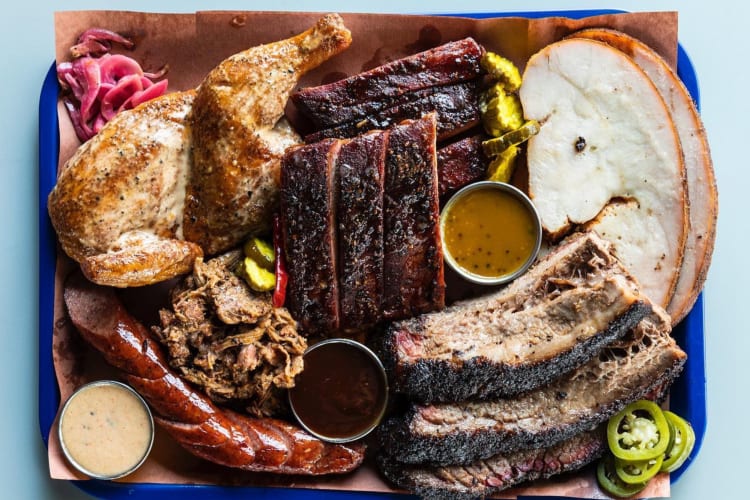 A serving plate with a variety of meats from Feges BBQ, a fantastic restaurant in Houston.