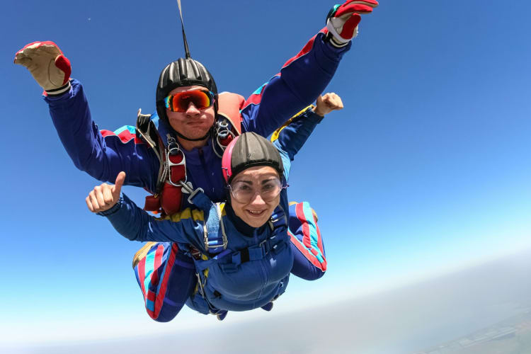 two people doing tandem skydiving