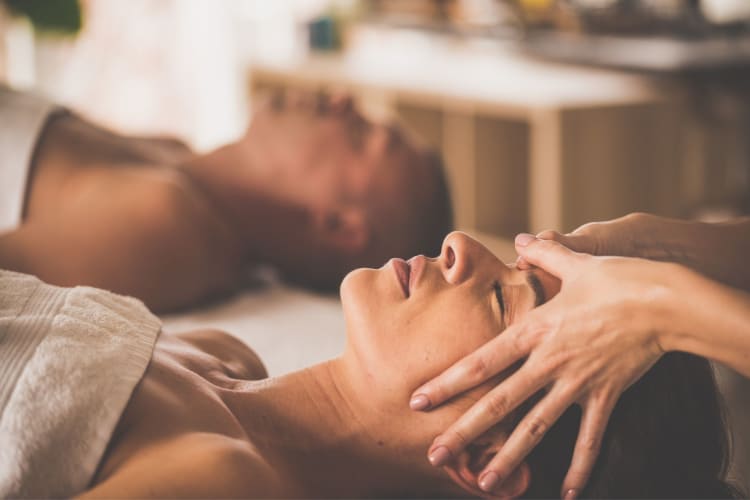 two women enjoying a massage at a spa