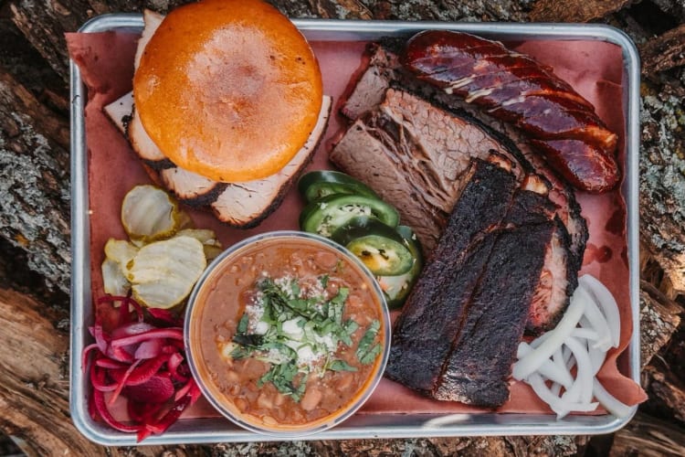 a trio platter of ribs, brisket and sausage