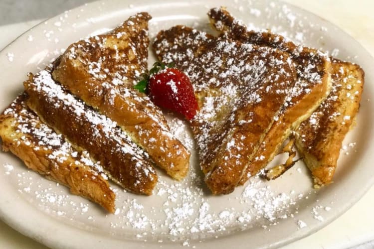 French toast with powdered sugar and strawberries