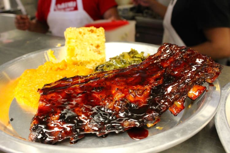 ribs on a platter with lots of sauce