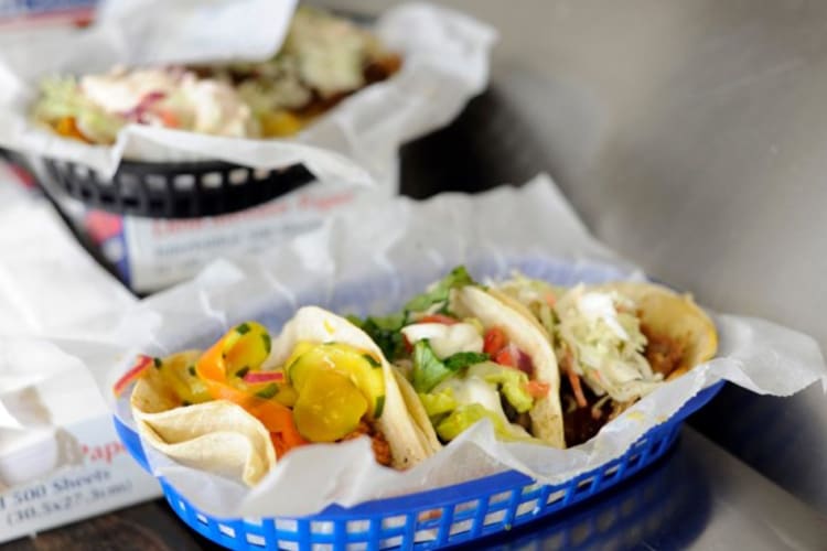 tacos in a blue basket