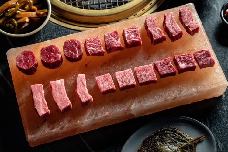 a tray of raw wagyu beef