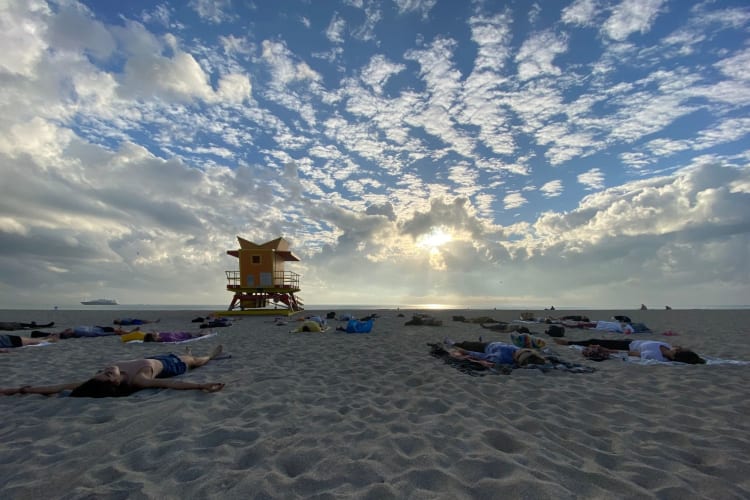 Yoga on the beach is a relaxing birthday idea in Miami.