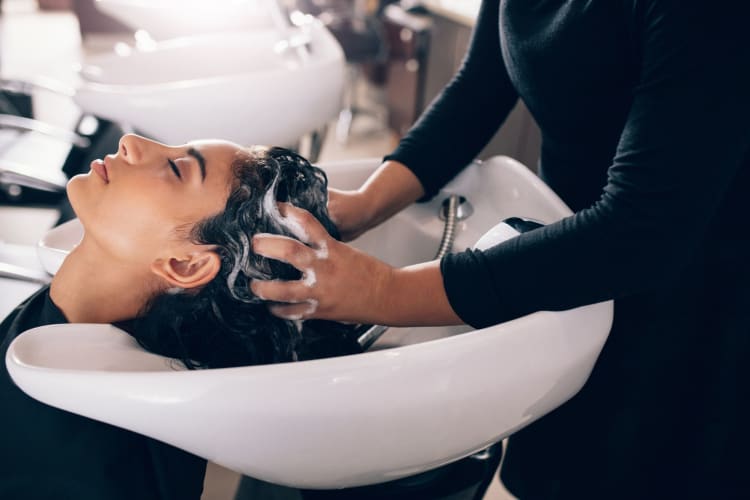 woman enjoying having hair washed