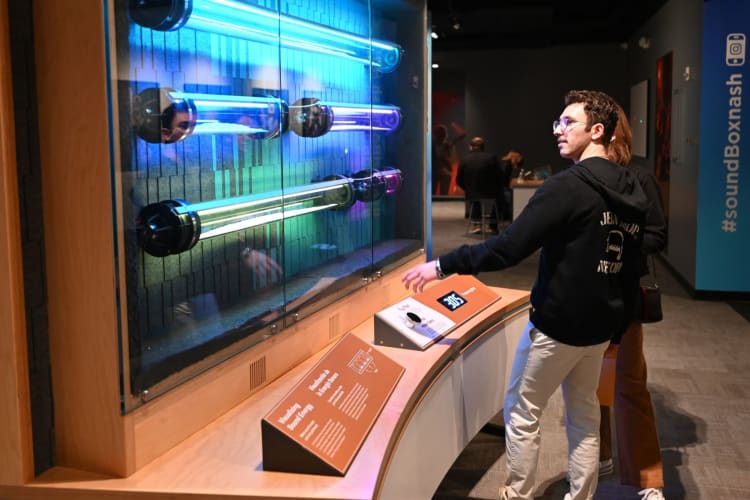 two people looking at an exhibit