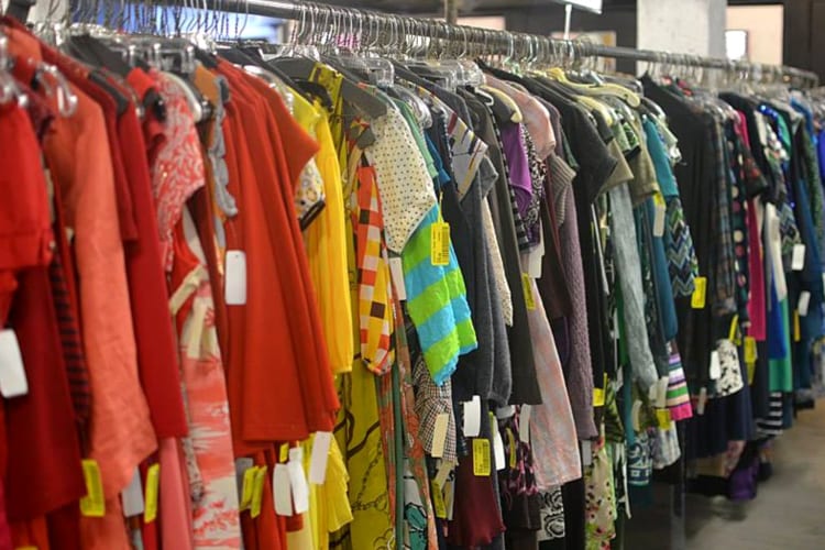 an array of clothes on hangers