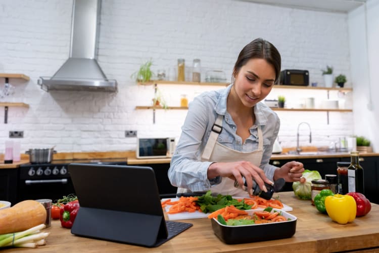 woman following a recipe on her tablet