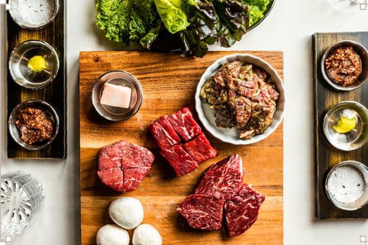 a spread of Korean BBQ meats waiting to be cooked