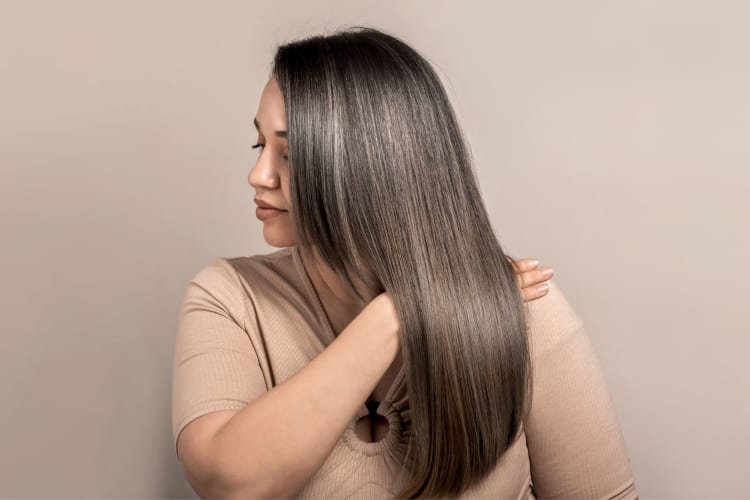 a woman showing her shiny hair