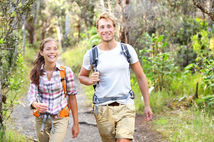 hiking couple in the woods