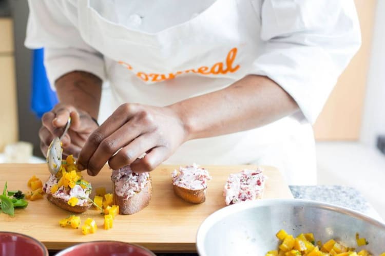 A chef preparing an appetizer