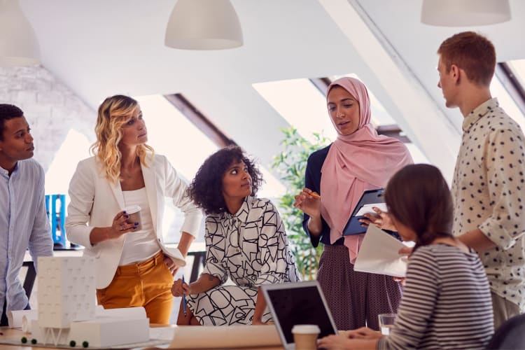 a diverse group of co-workers having a discussion