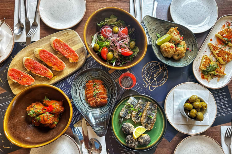 a decadent spread of tapas cuisine