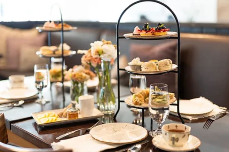 an afternoon tea tower laden with treats