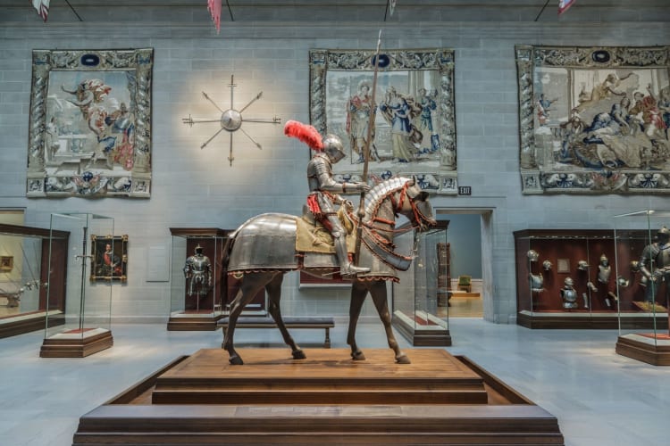 a suit of armor on a horse as an art exhibit