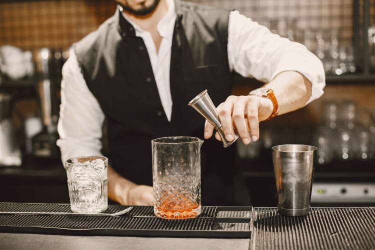 a mixologist preparing a drink