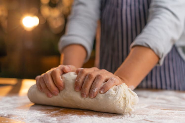 kneading pizza dough