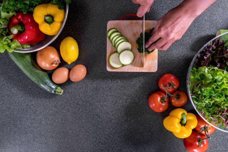 a chef cutting vegetables