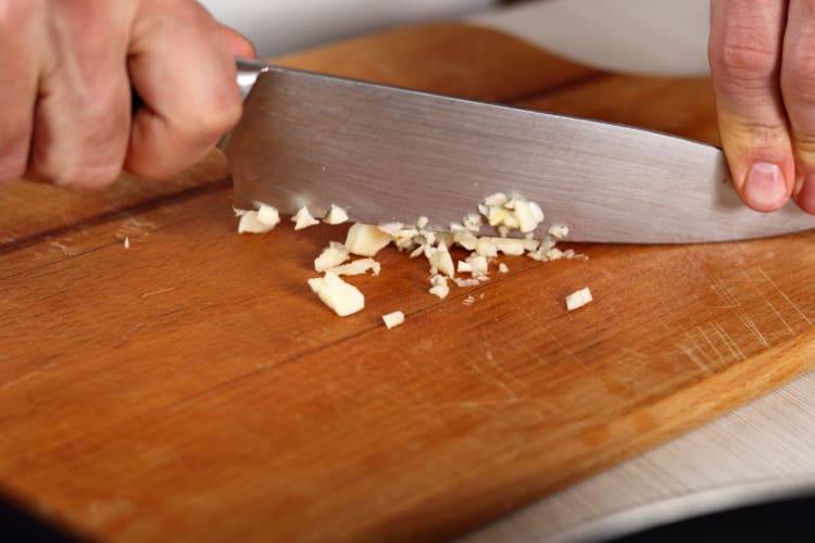 chef mincing garlic