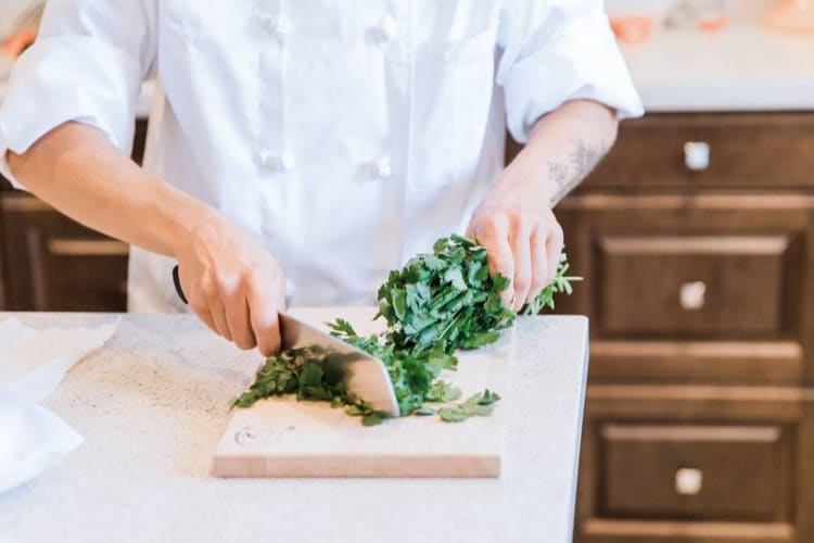 chef chopping cilantro