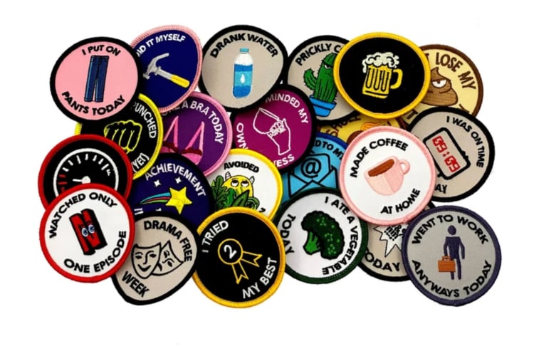 a colorful group of merit badges