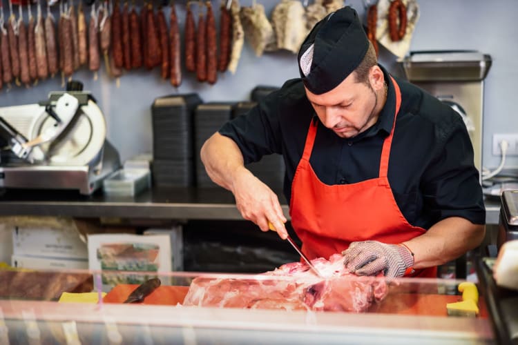 Man using a boning knife 