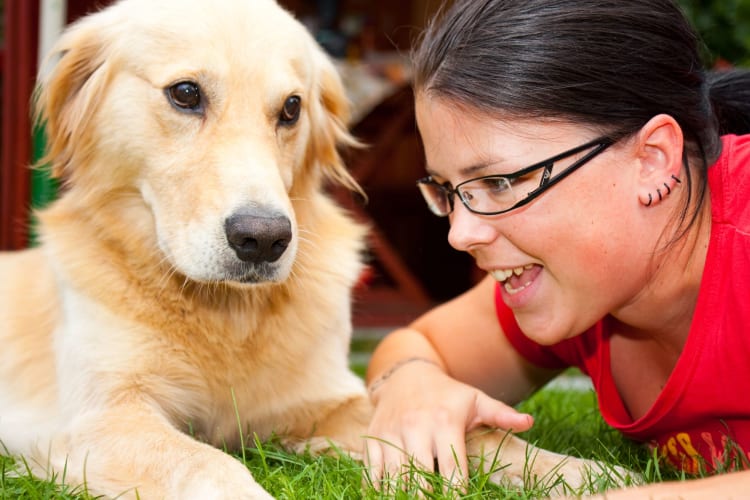 woman speaking to dog