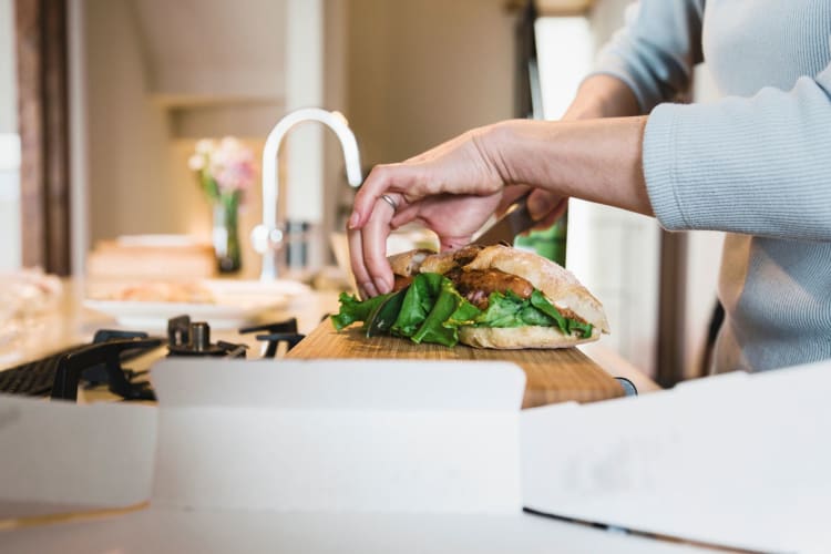 A utility knife is used to slice sandwiches.