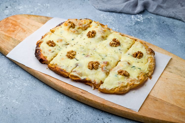 Roman-Style Pizza cut into eight square pieces, a popular Rome food