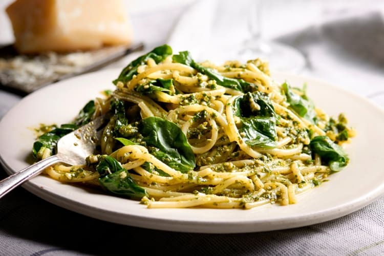 Pasta dish with a pesto sauce and green leaves, from Romano’s Macaroni Grill, a restaurant open on Christmas Day