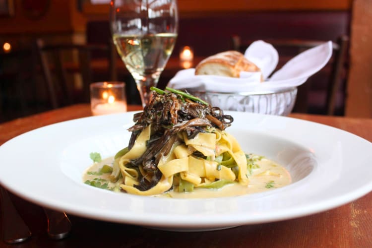 A bowl of mushroom pappardelle with mushrooms