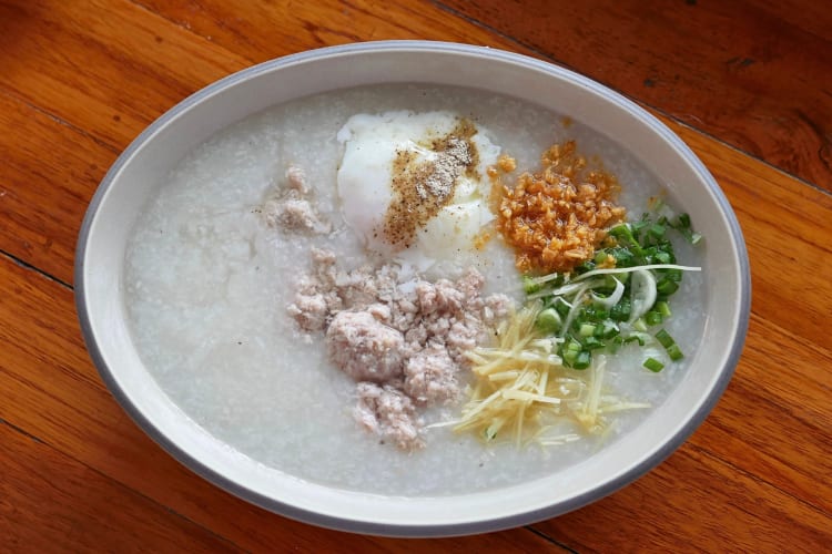 Aerial shot of congee with pork and vegetables