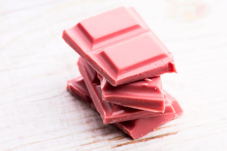 Squares of stacked ruby chocolate 