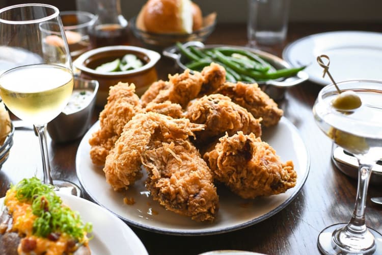Fried chicken pieces surrounded by other meals and drinks from Rye Plaza