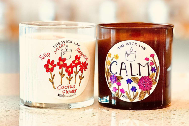 Two candles with floral labels