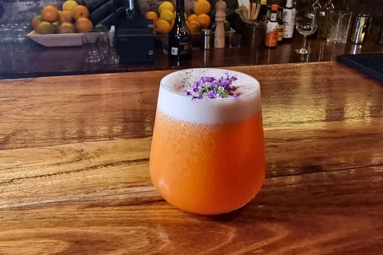 Orange-colored cocktail from Sabina Sabe, a restaurant in Oaxaca