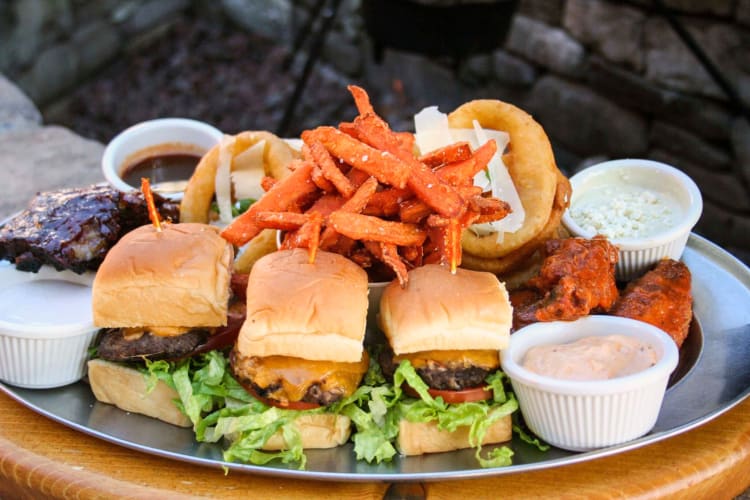 Sliders, fries, wings and onion rings from Saddle Ranch Chop House, a restaurant in Orange County