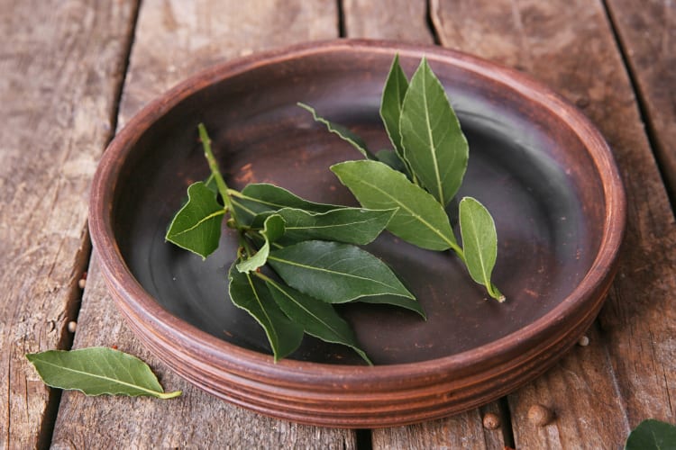 Bay leaves in a wooden bowl