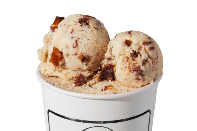 A caramel colored ice cream with mix-ins