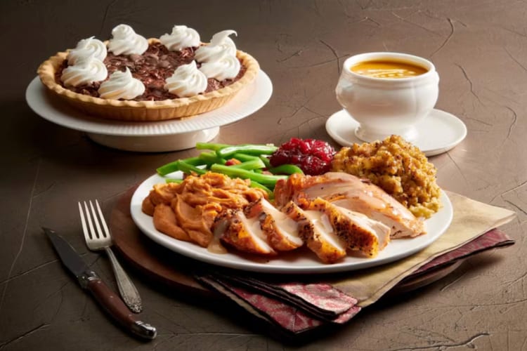 A selection of Thanksgiving dishes like turkey and pie