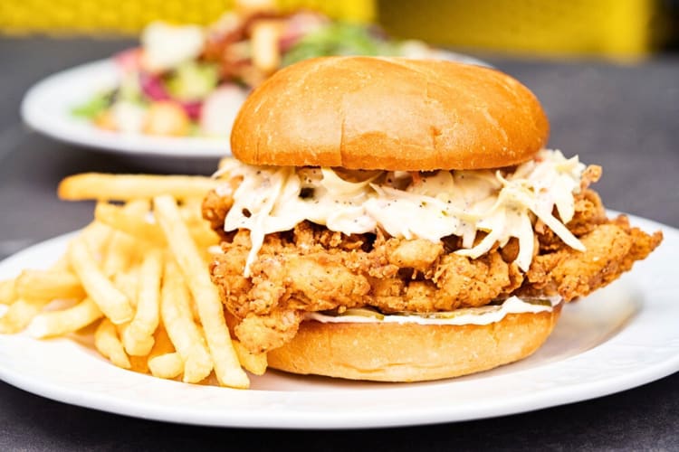Fried chicken sandwich and fries from Screen Door