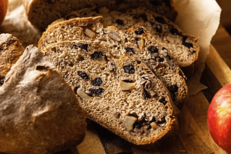 crusty apple cranberry dutch oven bread is a rustic, crusty loaf with a soft interior