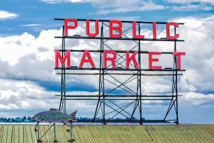 A red sign that says Public Market on a roof